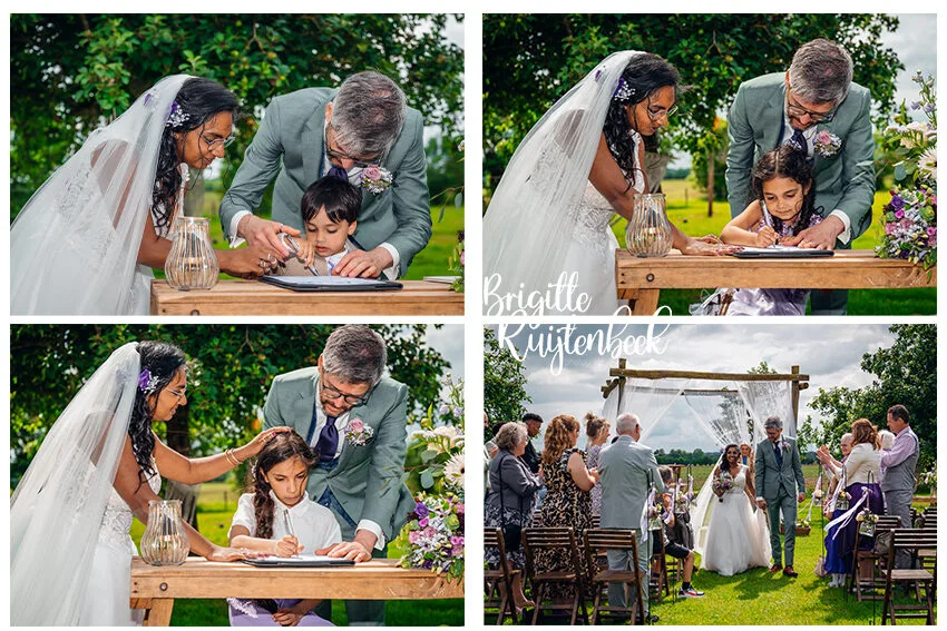 Kinderen tekenen de trouwakte tijdens de ceremonie van hun ouders bij De Weistaar in Maarsbergen.